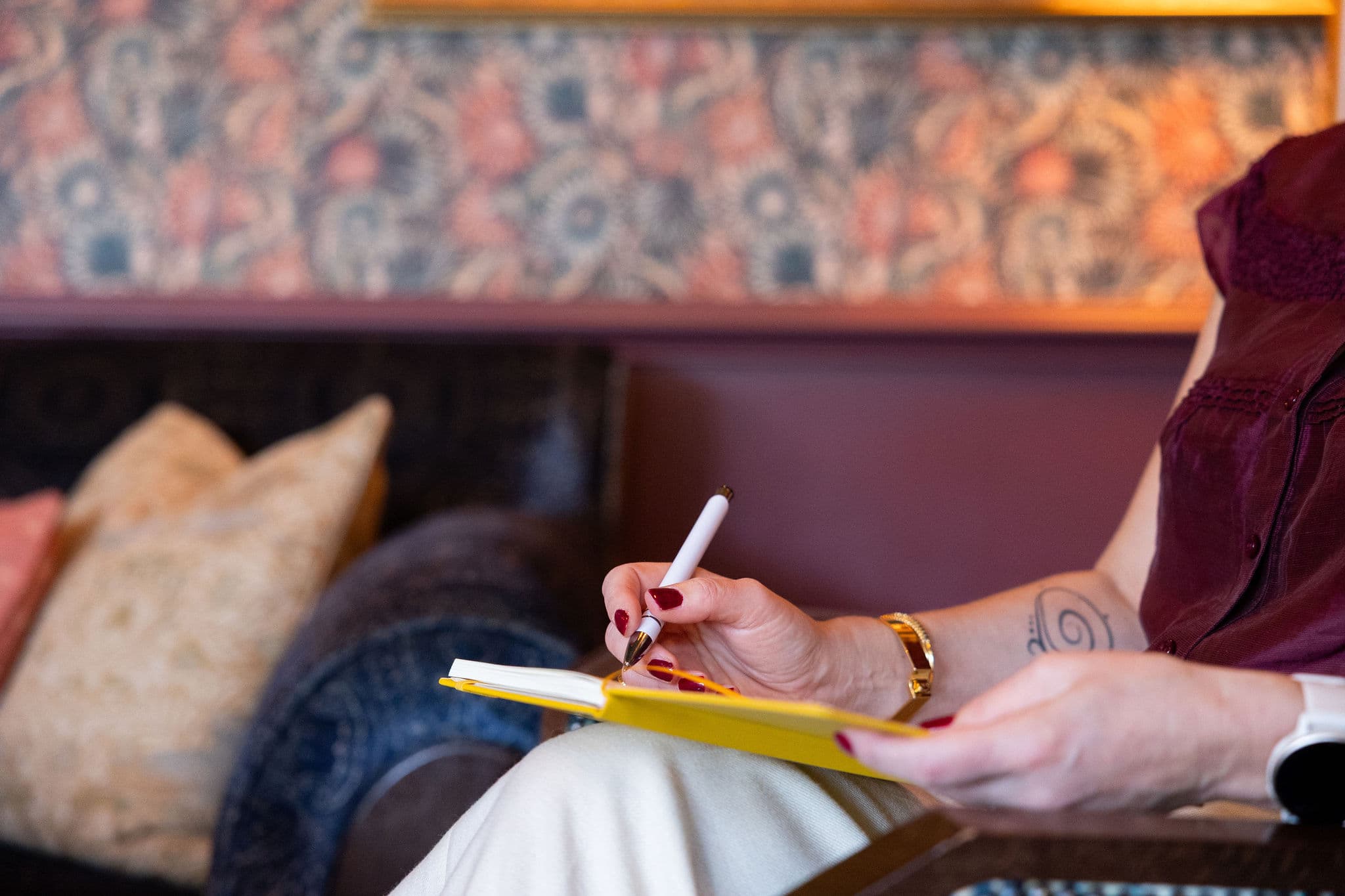 Notes being taken in a yellow notebook